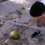 Kevin Longa hitting a coconut with a bamboo stick - #FoodEntrepreneur Friday: Fail Until You Succeed, Try Not to Go (Coco)Nuts