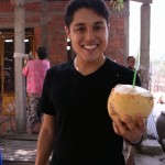 Kevin Longa enjoying a refreshing coconut drink in Ben Tre